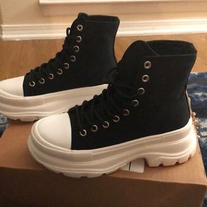 Black and white platform style athletic or boot